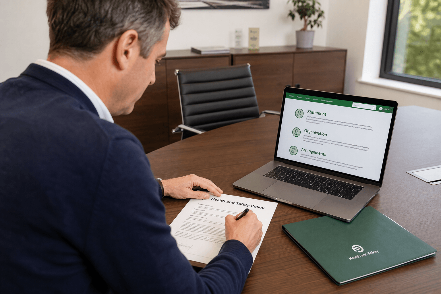 Director reviewing a living health and safety policy on a laptop